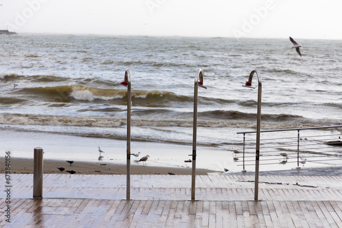 storm surge seen from behind the showers arranged on the bathhouse during the flood that occurred in Salerno