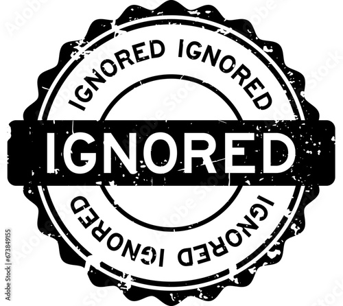 Grunge black ignored word round rubber seal stamp on white background