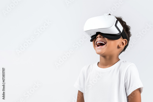 Young boy getting experience using VR headset glasses isolated on a white background with copy space