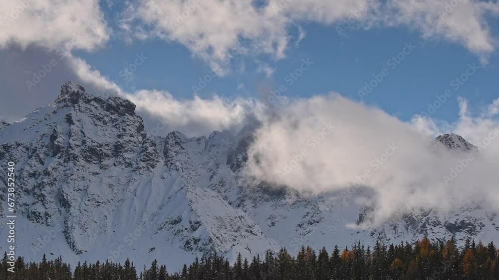 Moving clouds over the Alps mountains, Italy landscape in the autumn season Moving clouds over the Alps mountains, Italy landscape in the autumn season