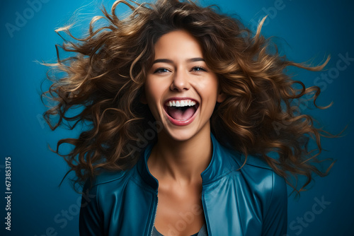 Woman with smile and leather jacket on.