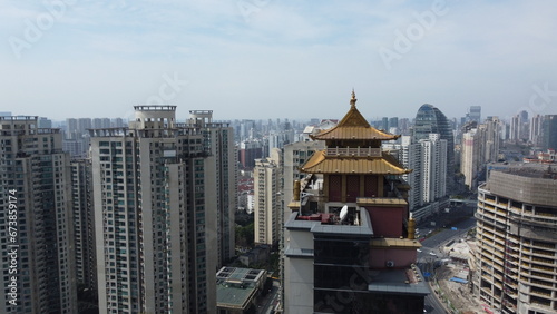 In XuJiaHui, Shanghai, a church and pagoda stand against the skyline, symbols of spiritual diversity. photo