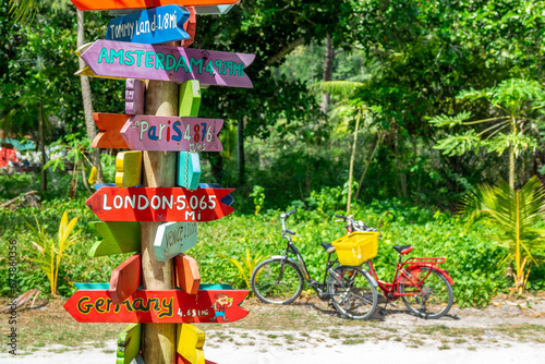 Bilde på lerret Bicycles and colorful wooden travel direction signs in La Digue island, Seychell