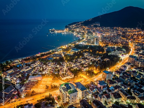 Gorgeous nighttime aerial view of the busting city of Budva, Montenegro