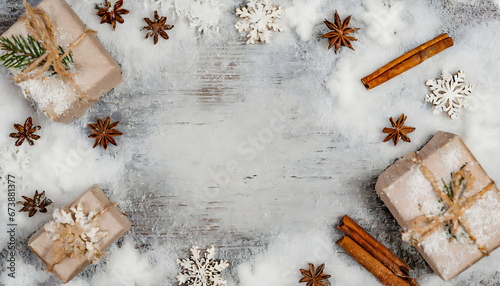 christmas background with snowflakes, cinnamon and gifts. Copy space for text
