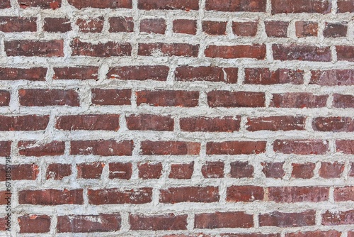 Rustic brick wall background in shades of brown and gray, with a slightly weathered look