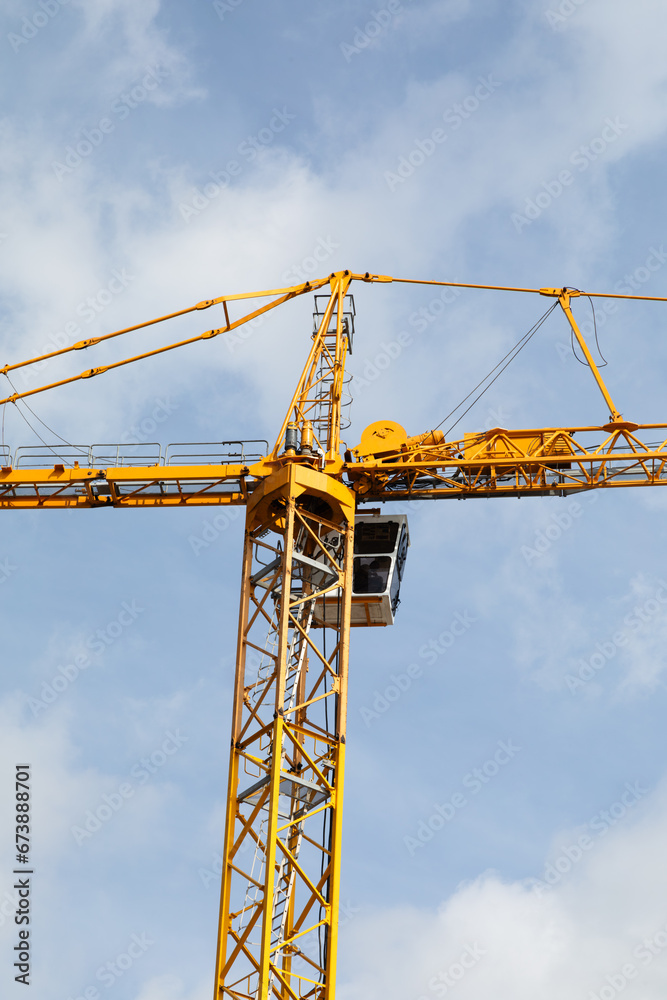 Construction crane set against sky 