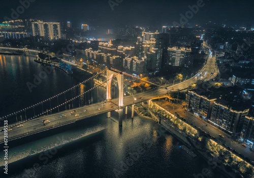 Night View of Hongguang Bridge and bulidings in Liuzhou, Guangxi, China, Asia photo