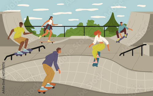 Group of teenage children skateboarding at urban skateboard park photo