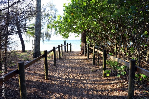 Picturesque coastal pathway leading to a tranquil beach in Hervey Bay photo