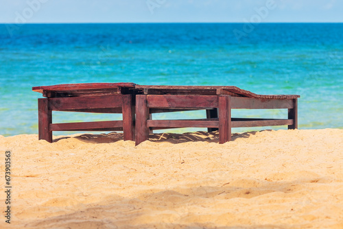 Wooden chairs on beach