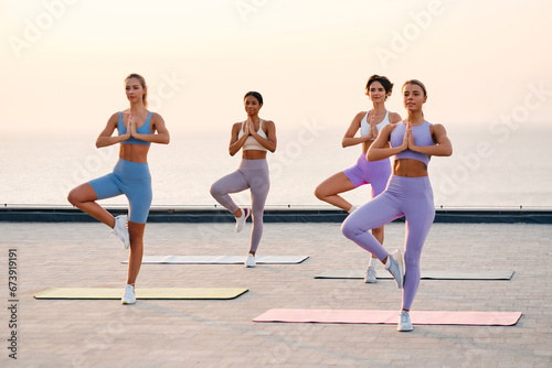 Young women doing yoga. Sport.