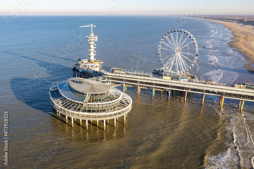 Aerial view Dutch pier Scheveningen with cityschape at The Hague photo