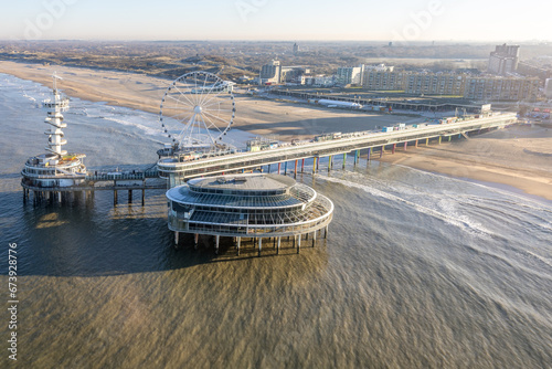 Aerial view Dutch pier Scheveningen with cityschape at The Hague photo