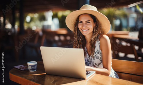 Happy Business woman at Restaurant Terrace with Laptop