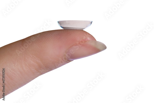 Female hand with contact lens on finger over a transparent background.