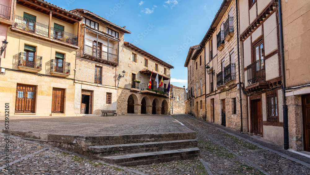 Main square with the town hall and old houses in the village of Frias, Burgos, Spain.