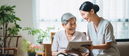 Asian Nurse or Physical therapist person visit Elderly patients at home