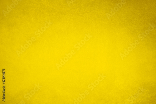 golden velvet fabric texture used as background. blond color panne fabric background of soft and smooth textile material. crushed velvet .luxury yellow tone for silk...