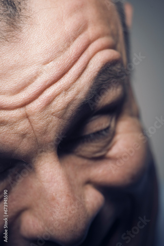Man 50s closeup face stress feelings emotions