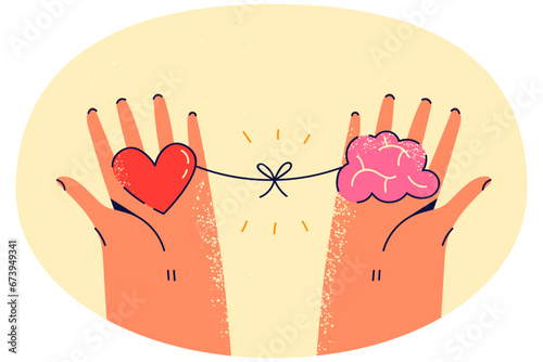 Person holding heart and brain in hands