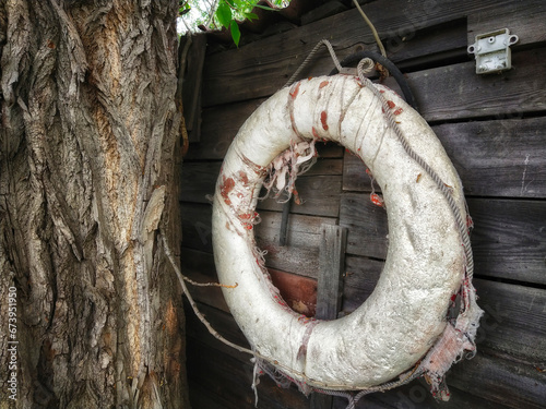 an old lifebuoy on the wall