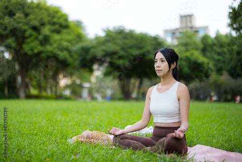 Woman do meditation at park