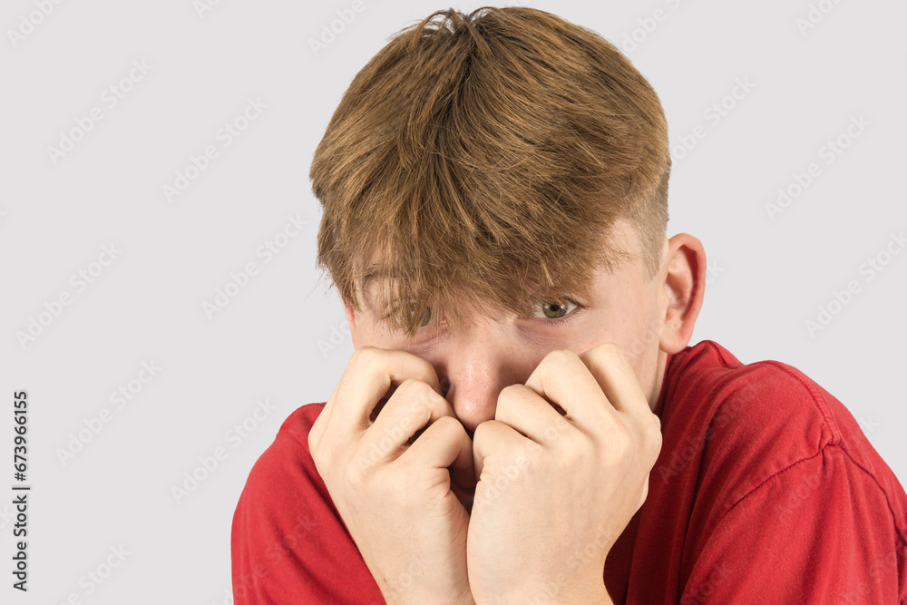 Headshot of a nervous teenage boy
