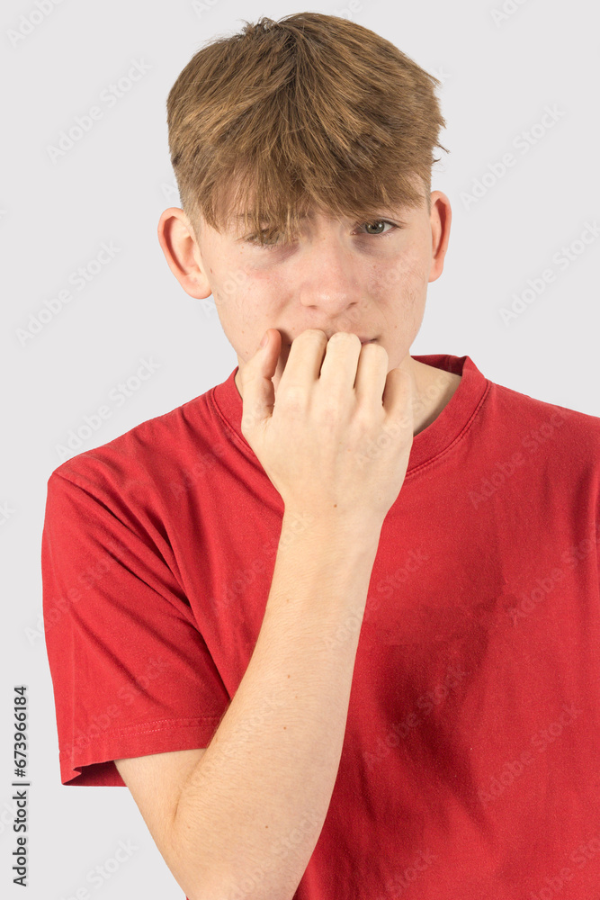 Headshot of a nervous teenage boy Headshot of a nervous teenage boy