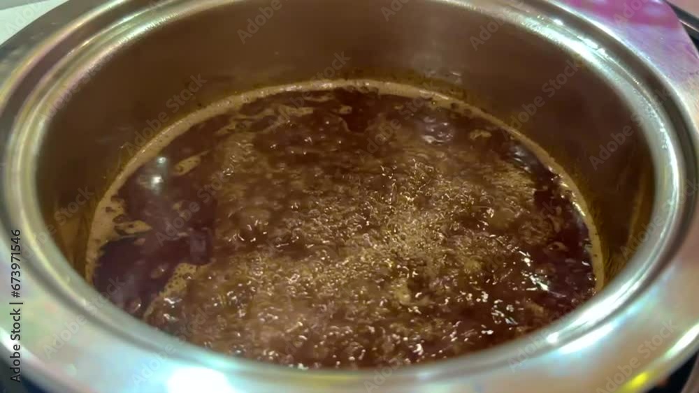 slow motion shot Spicy Chinese soup with chilli and spices for boiling pork slices in the meal. slow motion shot Spicy Chinese soup with chilli and spices for boiling pork slices in the meal.