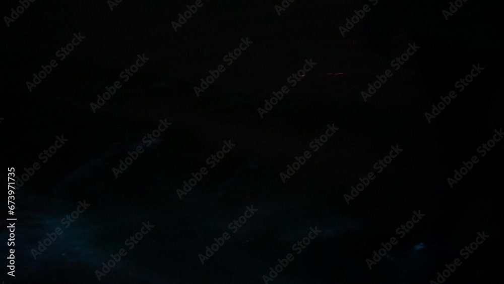 bioluminescent water being splashed