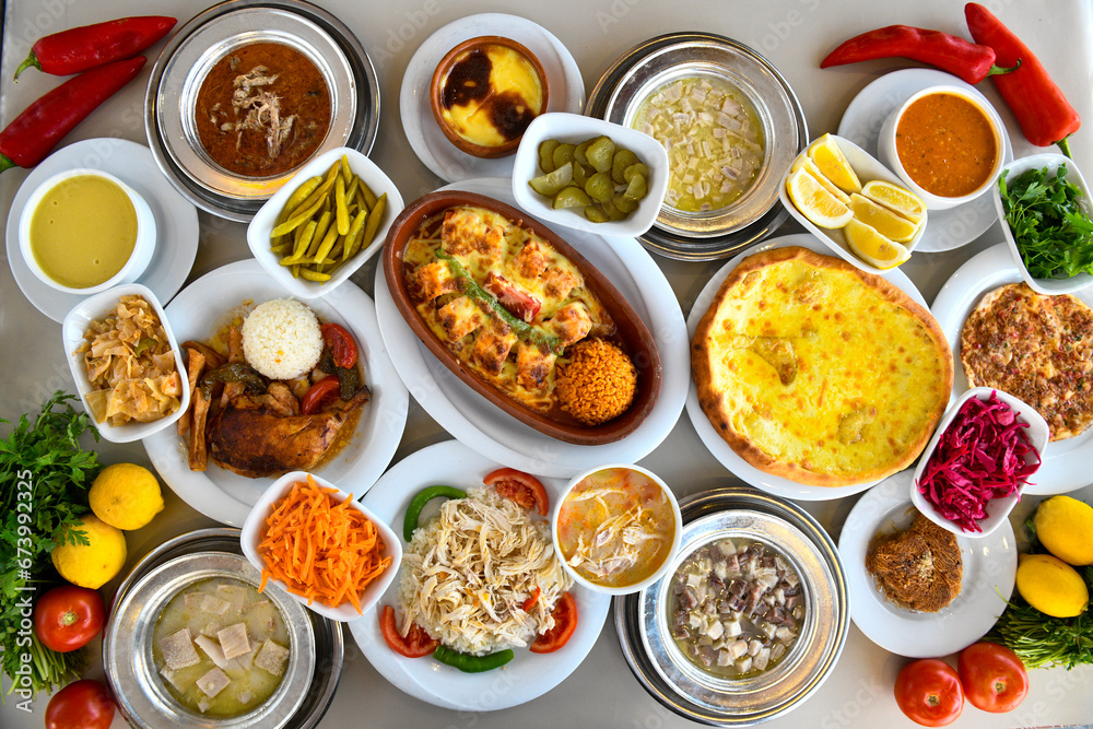 Table scene of assorted take out or delivery foods. Traditional Turkish cuisine. Various Turkish meal and appetizers. Top down view on a table. Table scene of assorted take out or delivery foods. Traditional Turkish cuisine. Various Turkish meal and appetizers. Top down view on a table.