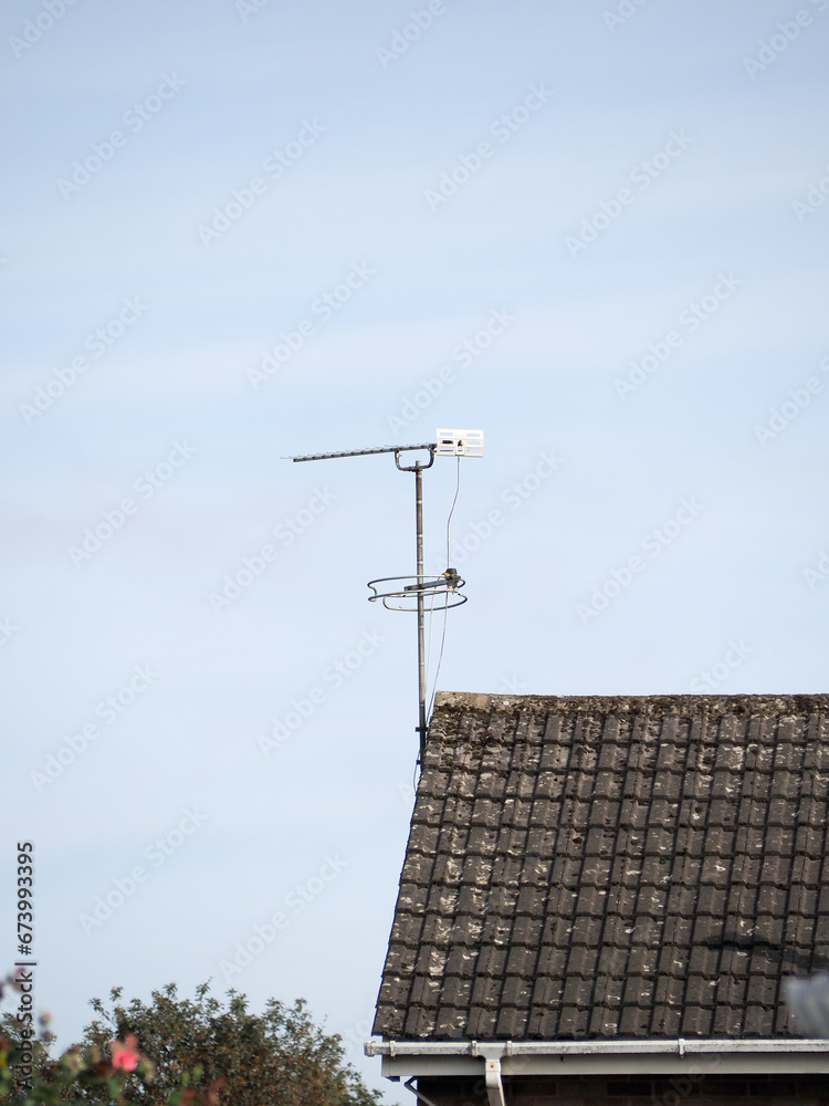 A domestic television aerial attached to a pitched roof