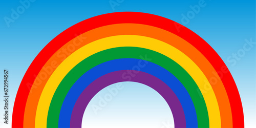 Rainbow in the colors of the gay flag on a sky background