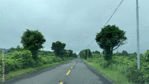 Drive down an open road, overcast day on Jeju-do Island in South Korea