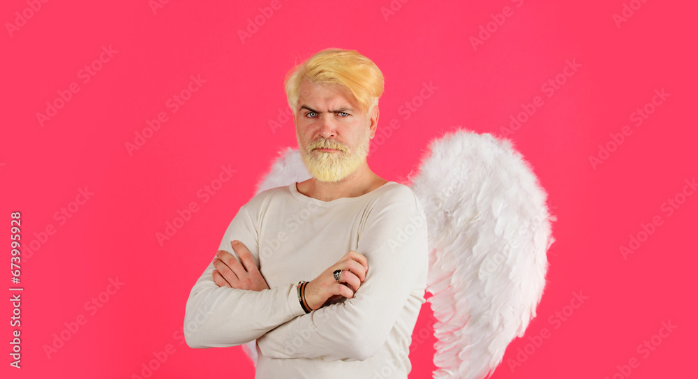 Happy Valentines Day. Male angel in white wings with crossed arms. Bearded man with blonde hair in angelic wings. Valentines Day banner with handsome cupid. Valentines day sale. Discount. February 14. Happy Valentines Day. Male angel in white wings with crossed arms. Bearded man with blonde hair in angelic wings. Valentines Day banner with handsome cupid. Valentines day sale. Discount. February 14.