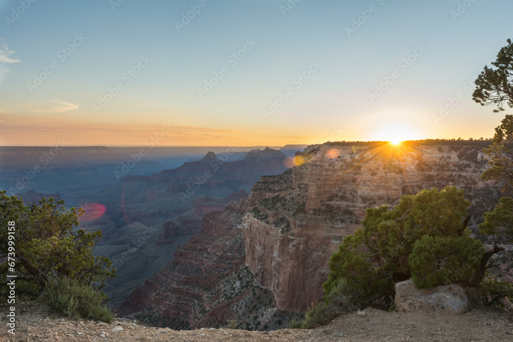 sun setting over the grand canyon