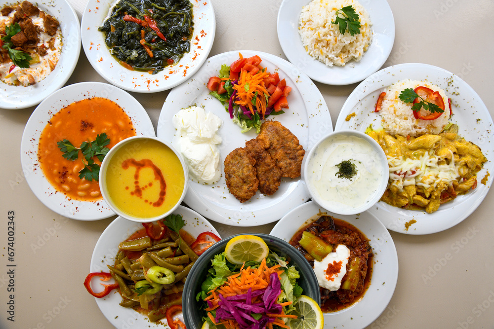 Table scene of assorted take out or delivery foods. Traditional Turkish cuisine. Various Turkish meal and appetizers. Top down view on a table.