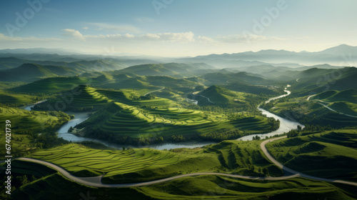 An aerial shot of a picturesque countryside with rolling hills and winding roads © Textures & Patterns
