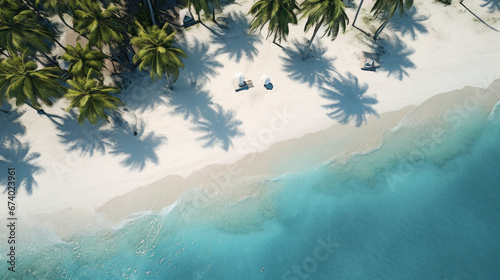 An aerial shot of a tranquil beach with white sand and palm trees  © Textures & Patterns