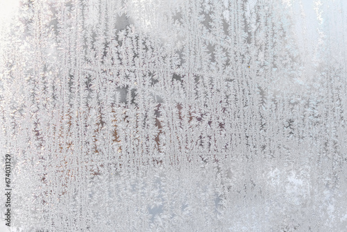 Snow pattern on the surface of frozen window glass.