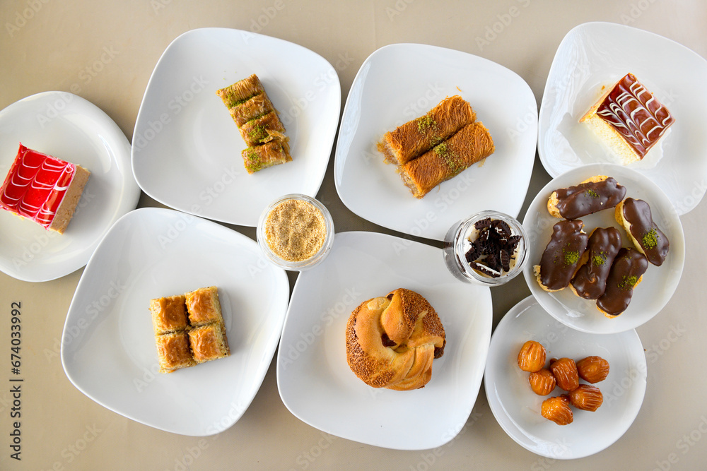 Table scene of assorted take out or delivery foods. Traditional Turkish cuisine. Various Turkish meal and appetizers. Top down view on a table. Table scene of assorted take out or delivery foods. Traditional Turkish cuisine. Various Turkish meal and appetizers. Top down view on a table.
