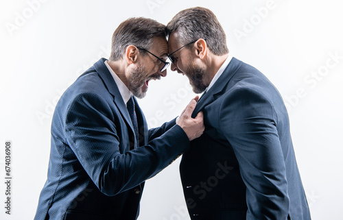 two businessmen fighting at rivalry isolated on white. unethical practice. businessmen having conflict fight in business. fighting between boss and employee. business fight