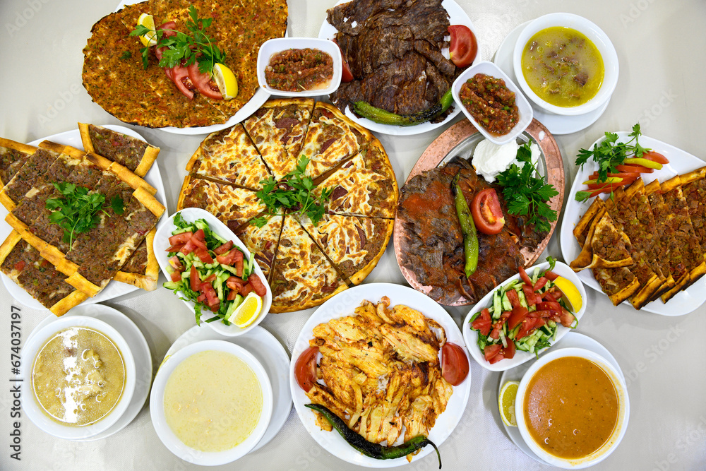 Table scene of assorted take out or delivery foods. Traditional Turkish cuisine. Various Turkish meal and appetizers. Top down view on a table. Table scene of assorted take out or delivery foods. Traditional Turkish cuisine. Various Turkish meal and appetizers. Top down view on a table.