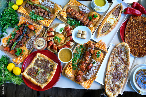 Table scene of assorted take out or delivery foods. Traditional Turkish cuisine. Various Turkish meal and appetizers. Top down view on a table. photo