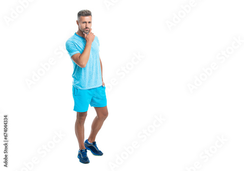 Athletic mature sport man standing, banner. Sport man standing wearing gym sportswear. Handsome sport man after workout in studio. runner sport man isolated on white background © be free