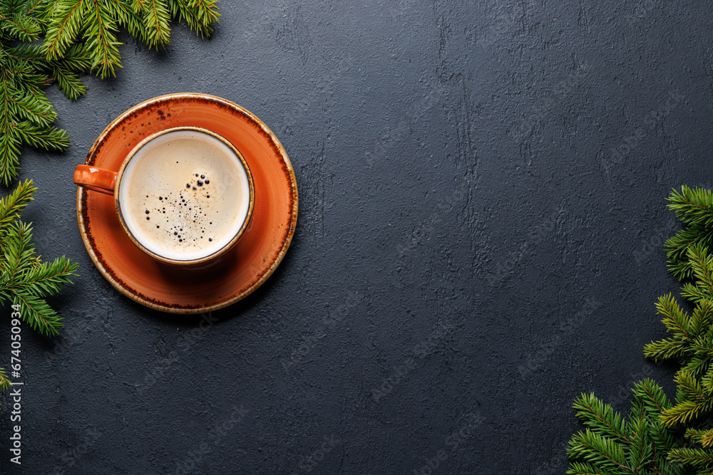 Coffee cup and fir tree branches in cozy setting Coffee cup and fir tree branches in cozy setting