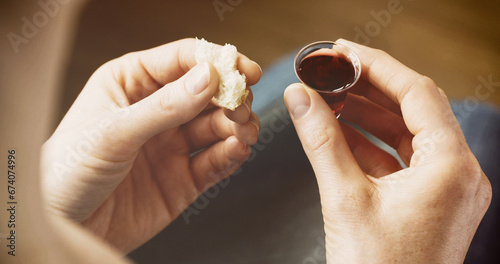 Woman taking communion - bread and wine. Christian faith and practice concept