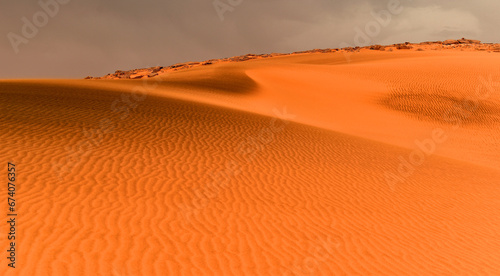 Sand dunes in the Sahara Desert, black packed sand, Algeria