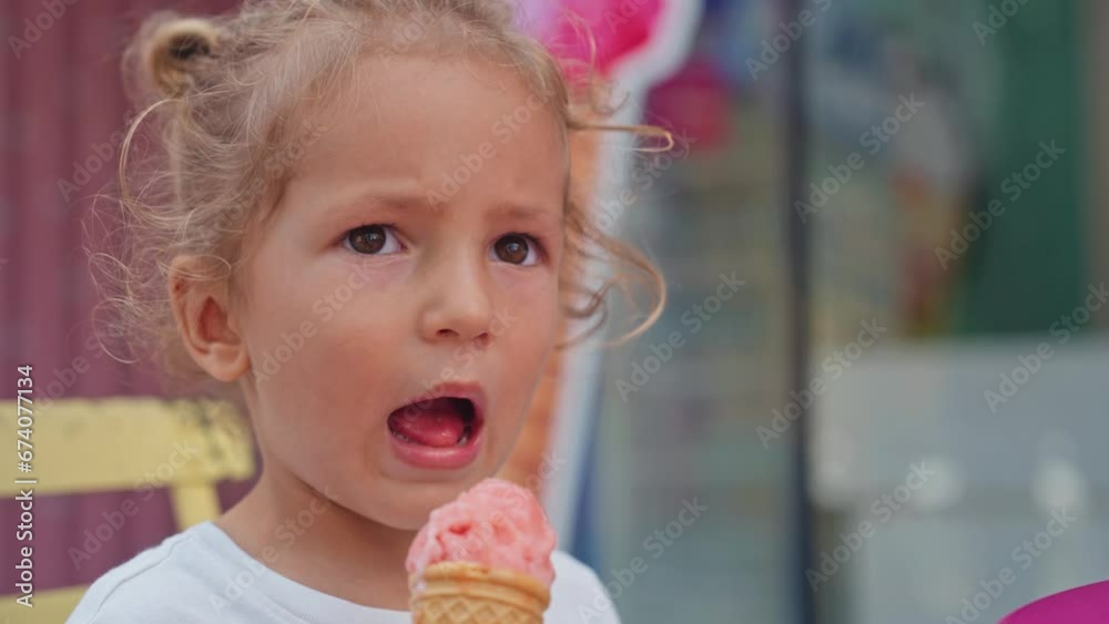 Happy mother and son eating ice cream. Close-up of a little boy and a young woman eating an ice cream together Happy mother and son eating ice cream. Close-up of a little boy and a young woman eating an ice cream together